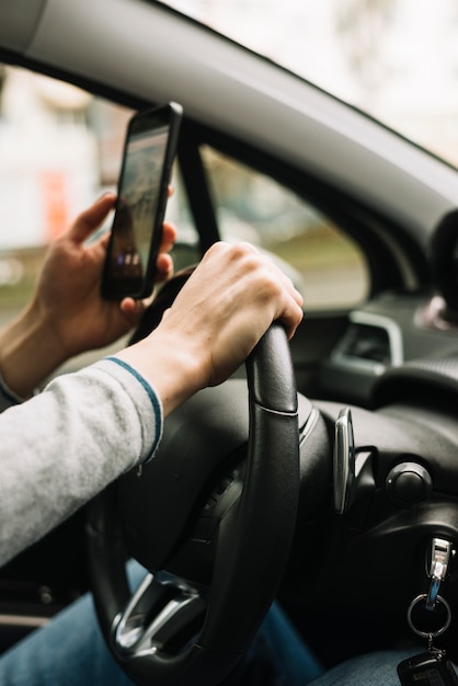 Close up of man driving car