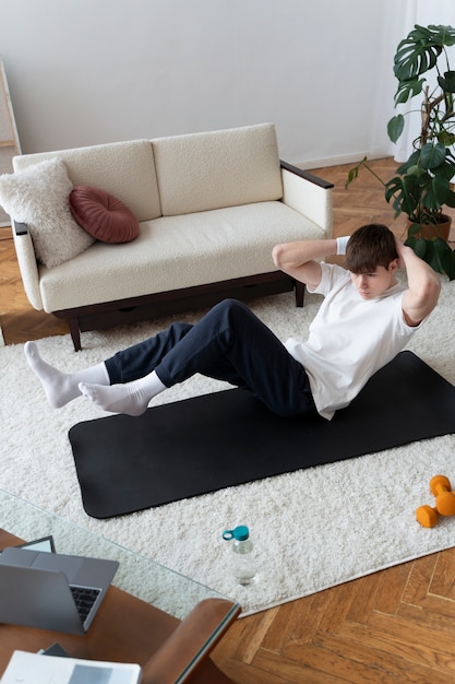 Free photo close up on man exercising after online instructor