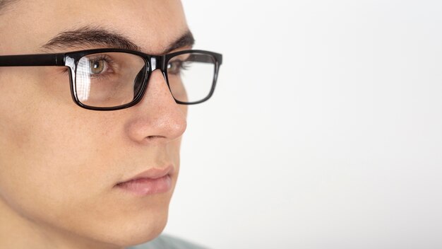 Close-up of man face with glasses and copy space