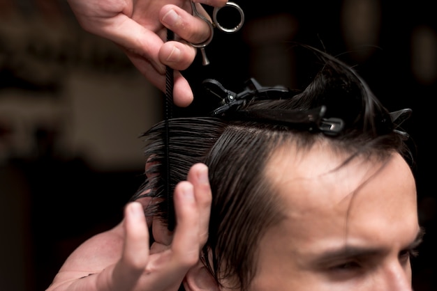 Close up man getting a haircut