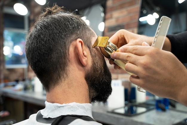 Close up man getting a haircut