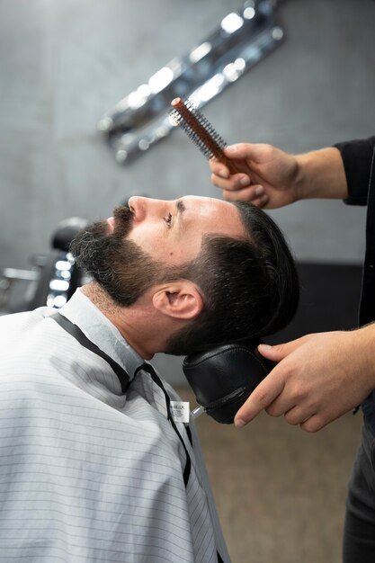 Close up man getting haircut