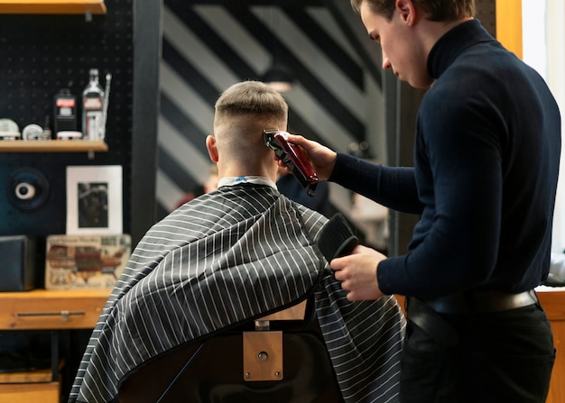 Close up man getting haircut