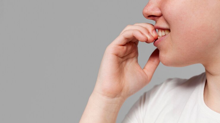 Free Photo close-up man gnaw nails
