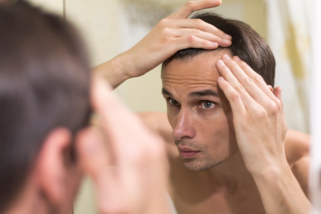 Close up man grooming hair