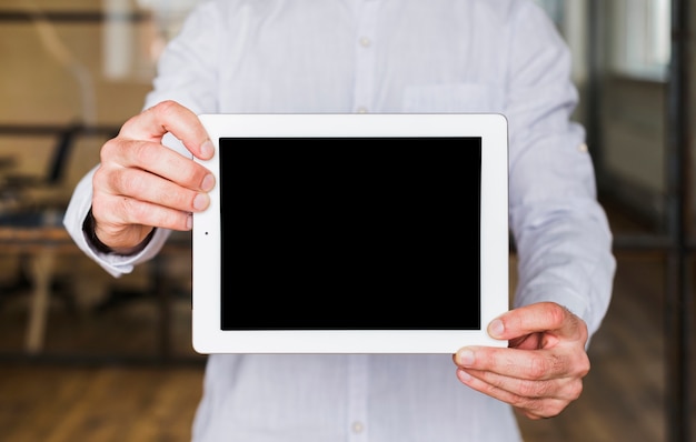 Close-up of man hand showing digital tablet