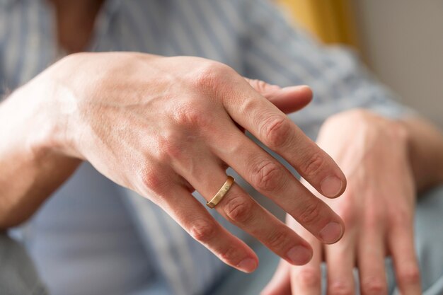 Close-up man hands wearing ring