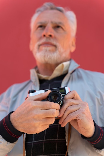 Close up man holding camera