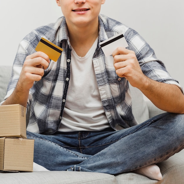Close-up man holding credit cards