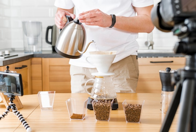 Close-up man holding kettle