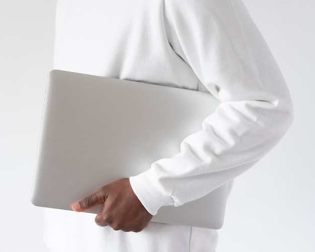 Close up man holding laptop