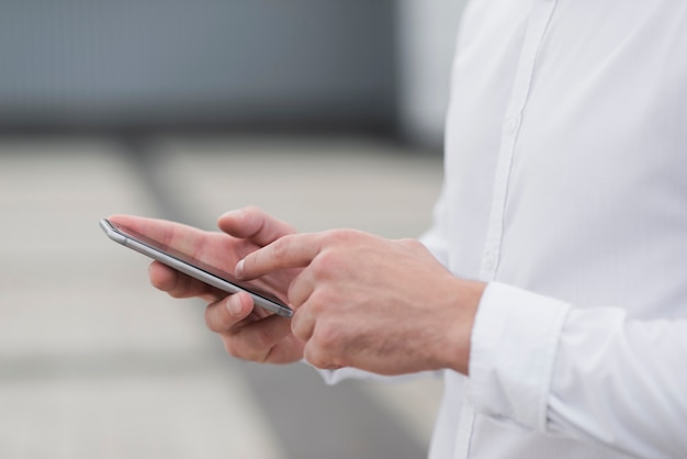 Close up of man holding phone