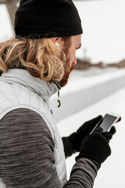 Close-up man holding phone