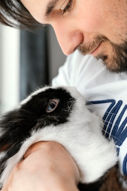 Close up man holding rabbit