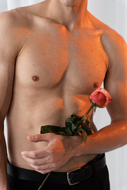 Close up man holding rose