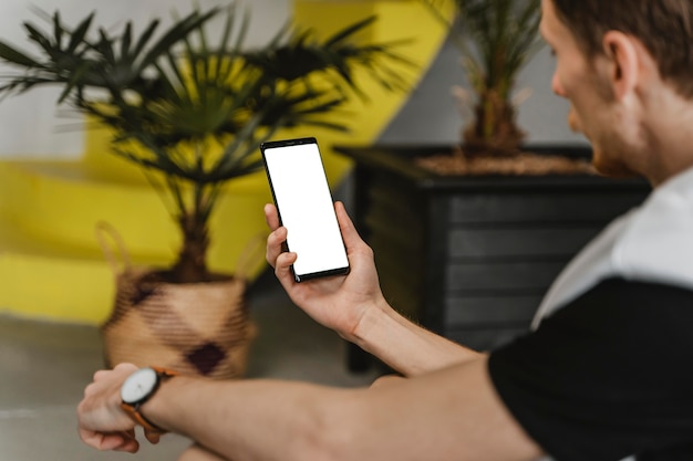 Close-up man holding smartphone