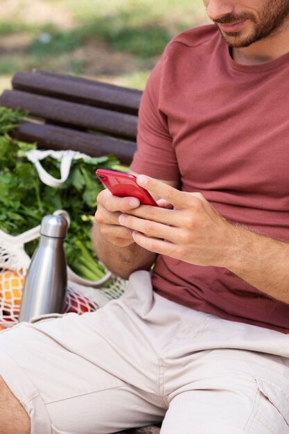 Close up man holding smartphone