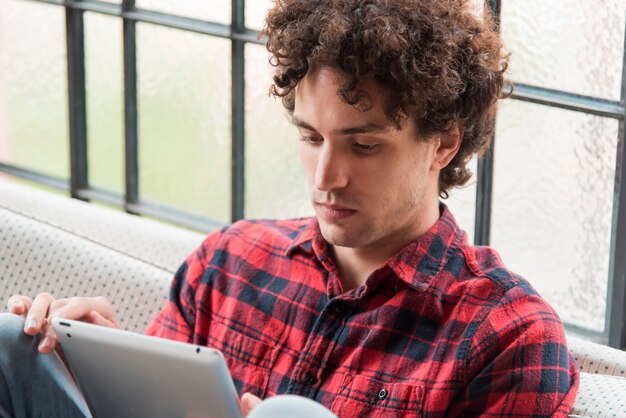 Close-up man holding tablet