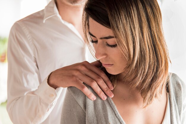 Close-up man holding woman