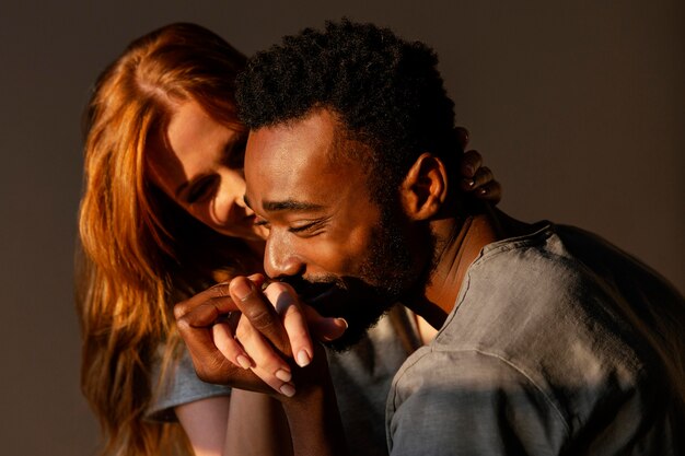 Close-up man kissing woman's hand