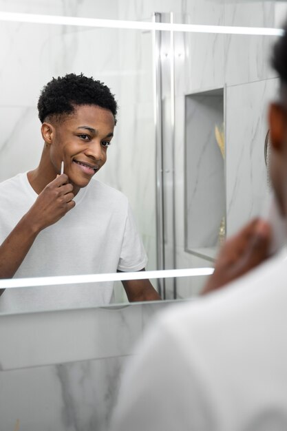 Close up man looking in mirror