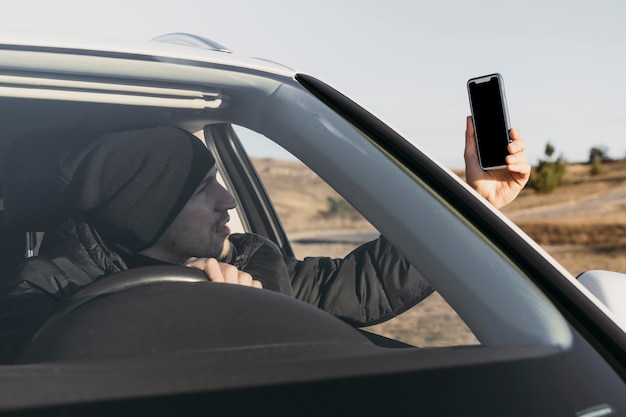 Close-up man looking at phone