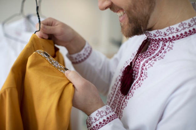 Close up man looking at ukranian shirt