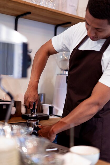 Close up man making coffee