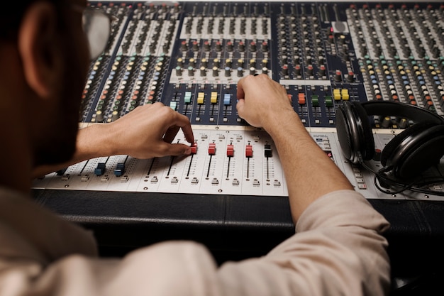 Free photo close up man making music