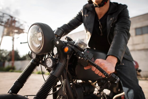 Close-up man on old motorcycle