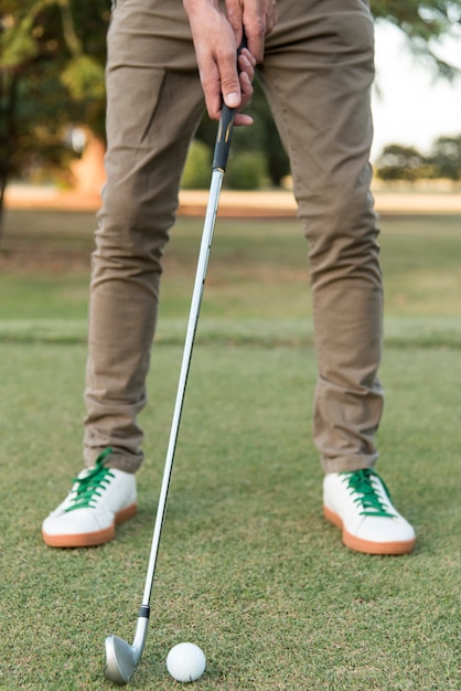 Close-up man playing golf