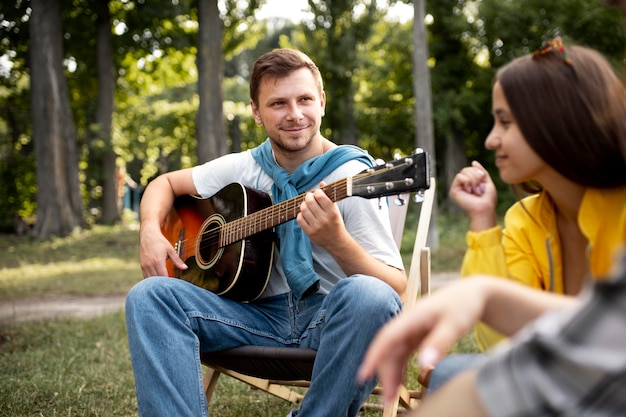 Close up man playing the guitar