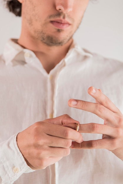 Close-up man pulling out ring