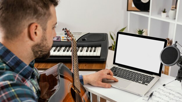 Close-up man recording a song