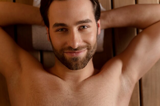 Close up on man relaxing in the sauna