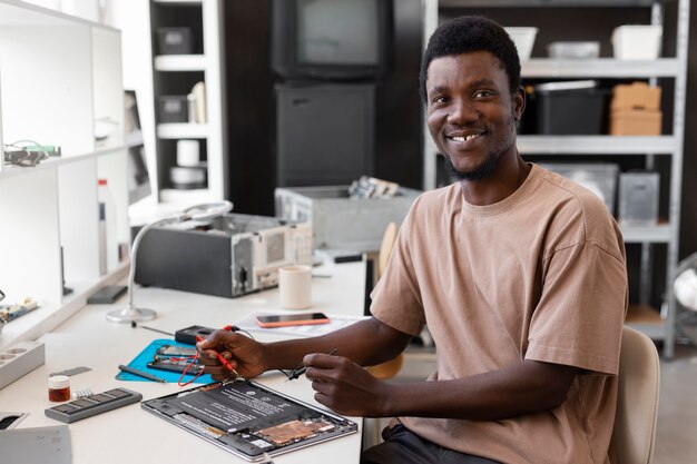 Close up on man repairing computer chips