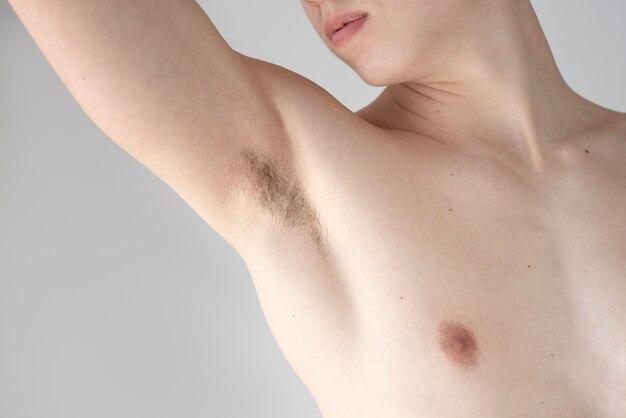 Close up on man revealing her armpit