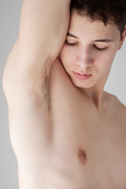 Close up on man revealing her armpit