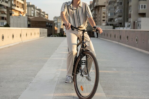 Close-up man riding bike in city