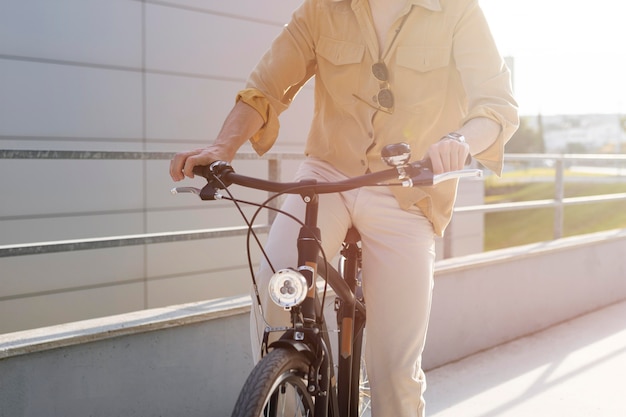 Free photo close-up man riding bike