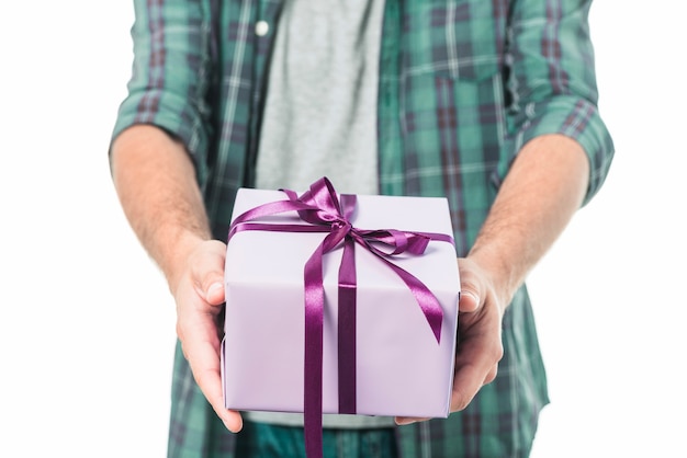 Close-up of a man's hand holding gift box