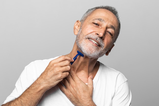 Close-up man shaving his neck