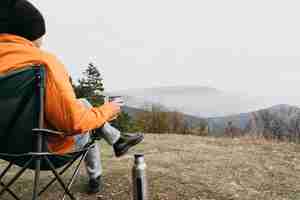 Free photo close-up man sitting on chair