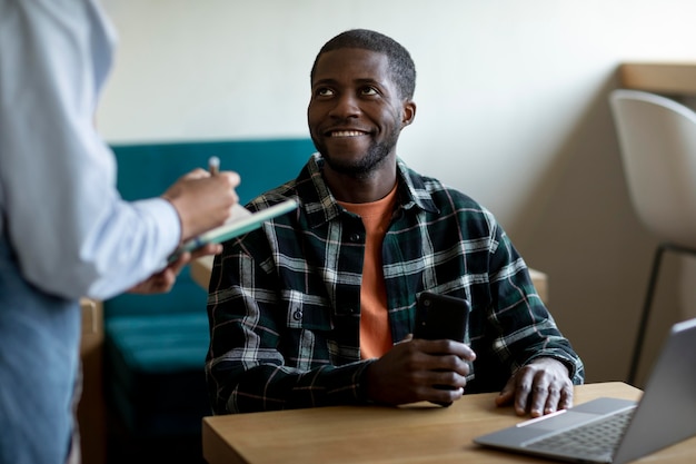 Close up man sitting at table