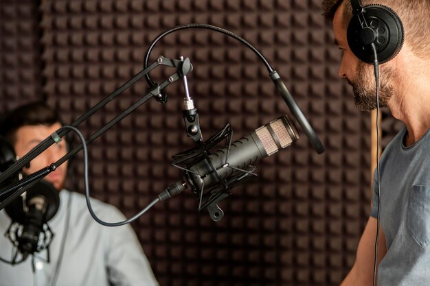 Close-up man speaking at microphone