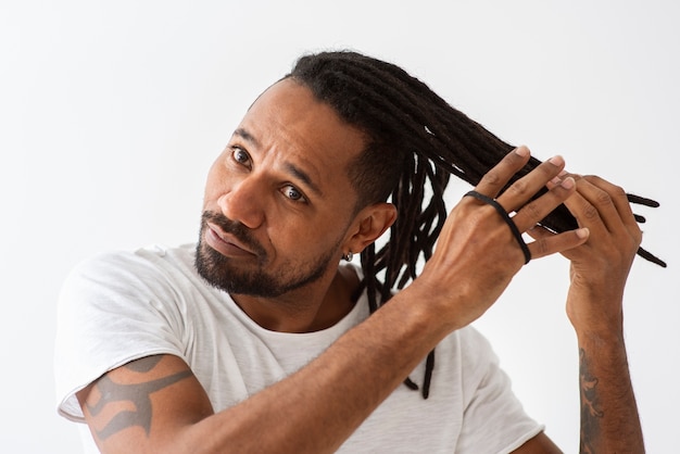 Close up man taking care of hair