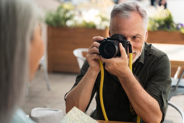 Close up man taking photos of woman