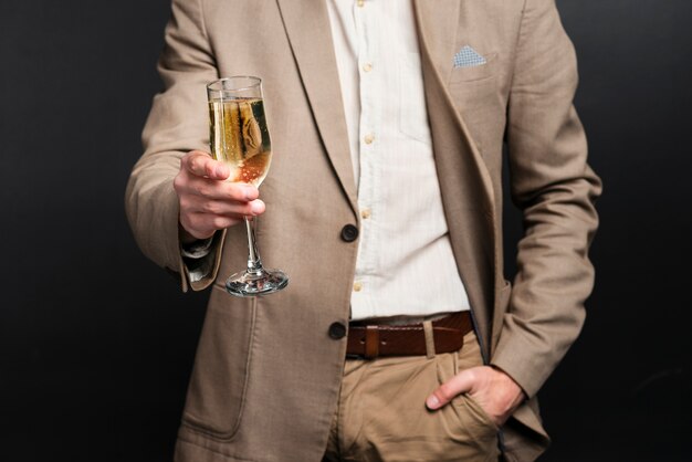 Close-up of man toasting for new years