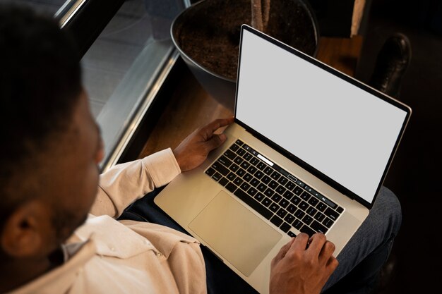 Close up man typing on keyboard