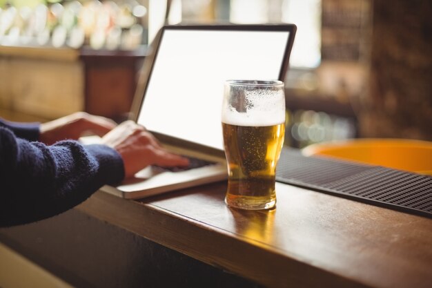 Close-up of man using laptop